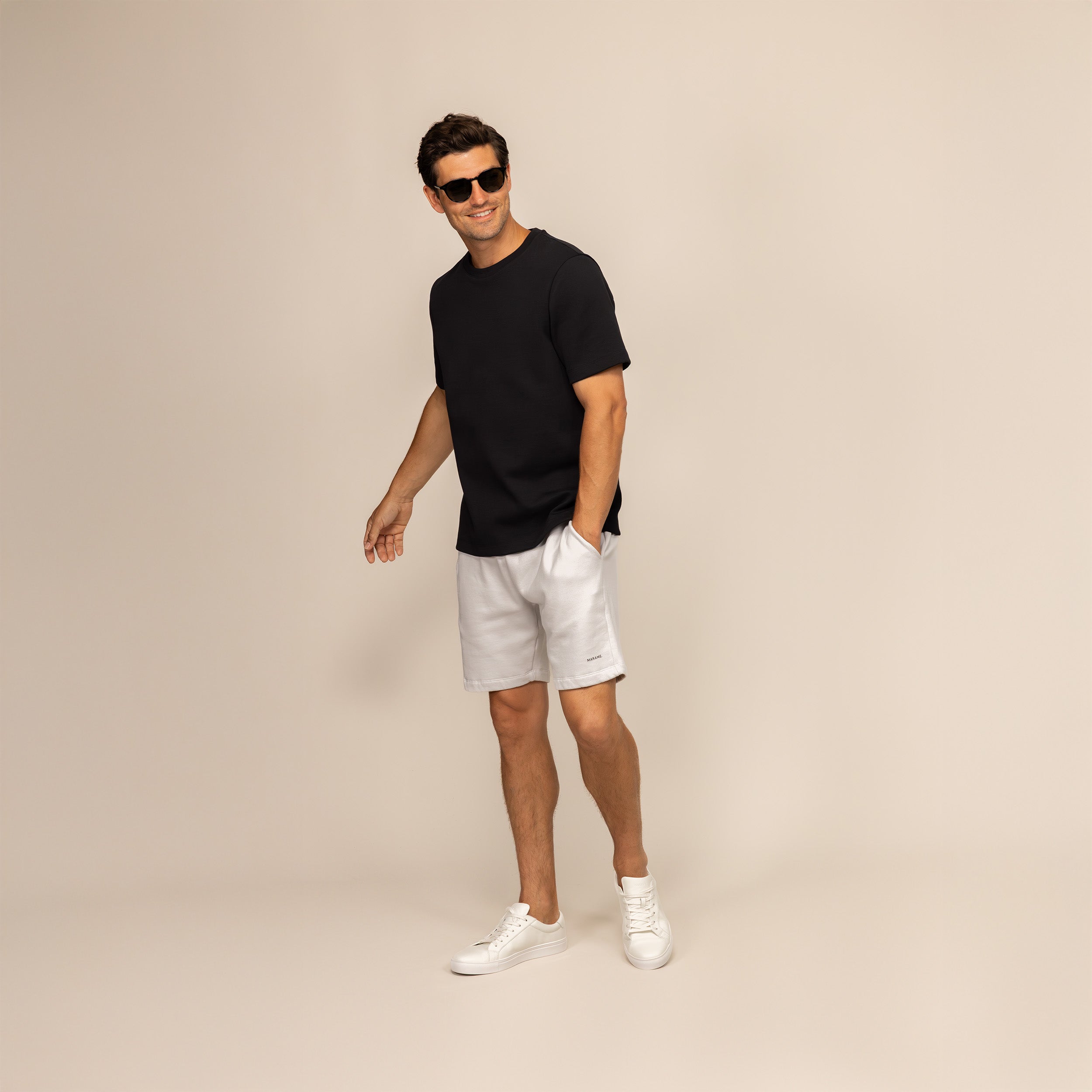 Man wearing a Marame Relaxed Fit T-Shirt in Black, front view.