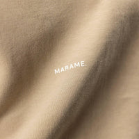 Man wearing a Marame Relaxed Fit T-Shirt in Canyon Clay, closeup.