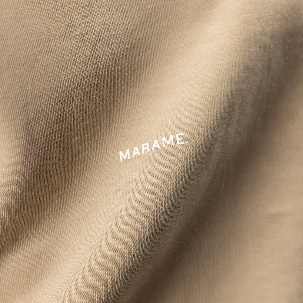 Man wearing a Marame Relaxed Fit T-Shirt in Canyon Clay, closeup.  |Canyon Clay