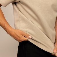 Man wearing a Relaxed Fit T-Shirt in Canyon Clay, closeup. |Canyon Clay