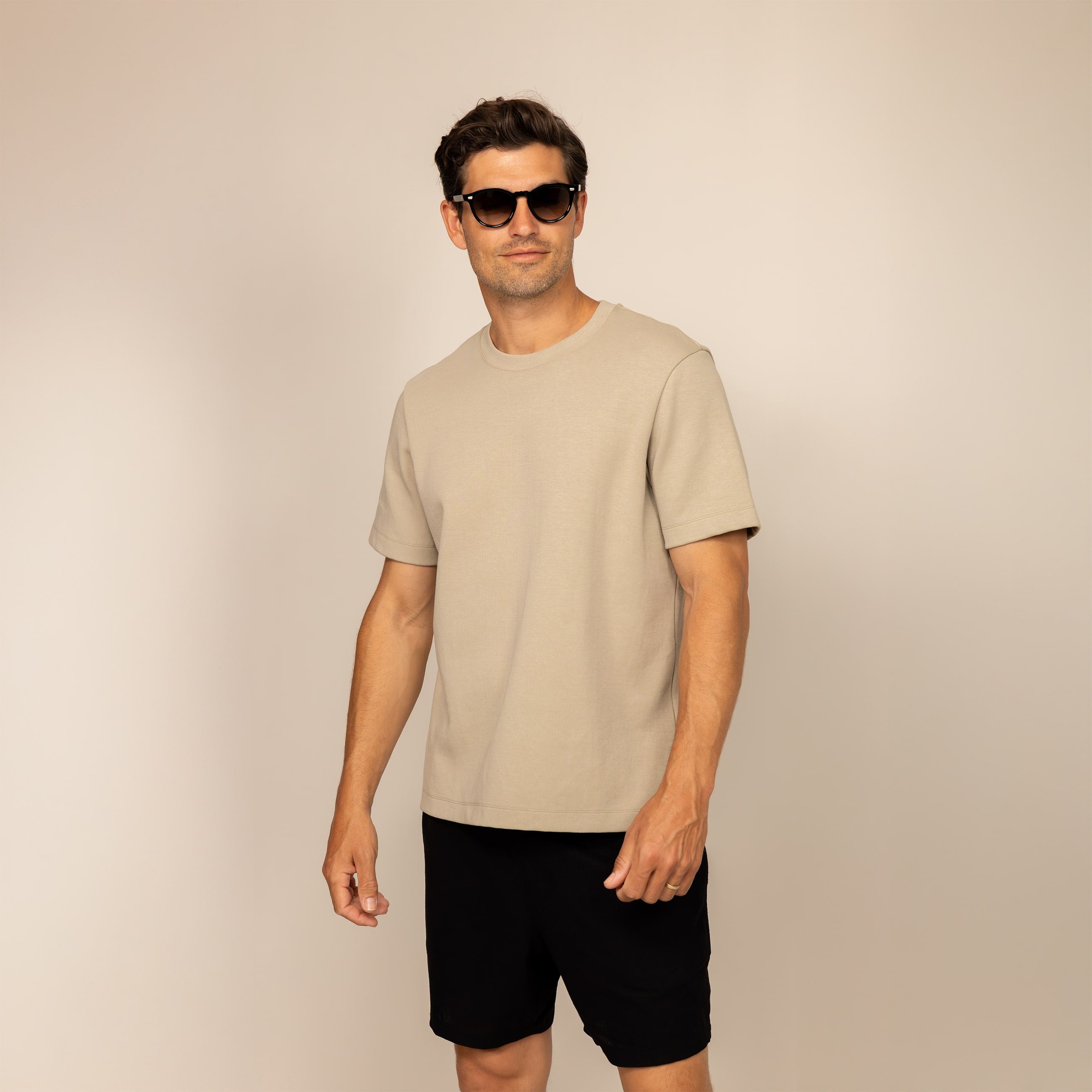 Man wearing a Marame Relaxed Fit T-Shirt in Canyon Clay, front view.