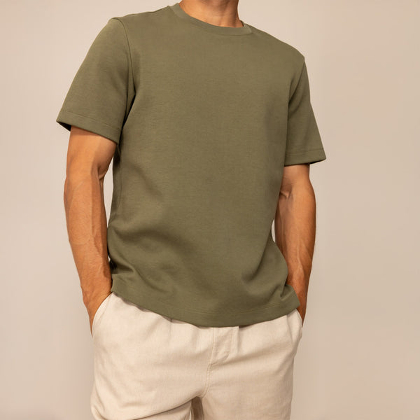Man wearing a Marame Relaxed Fit T-Shirt in Olive, front view.