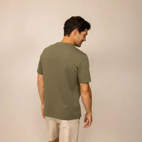 Man wearing a Marame Relaxed Fit T-Shirt in Olive, rear view. |olive