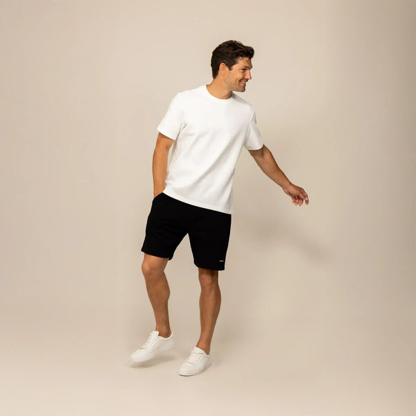 Man wearing a Marame Relaxed Fit T-Shirt in White, front view.