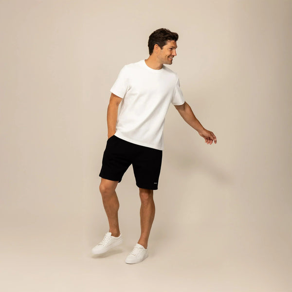 Man wearing a Marame Relaxed Fit T-Shirt in White, front view. |White