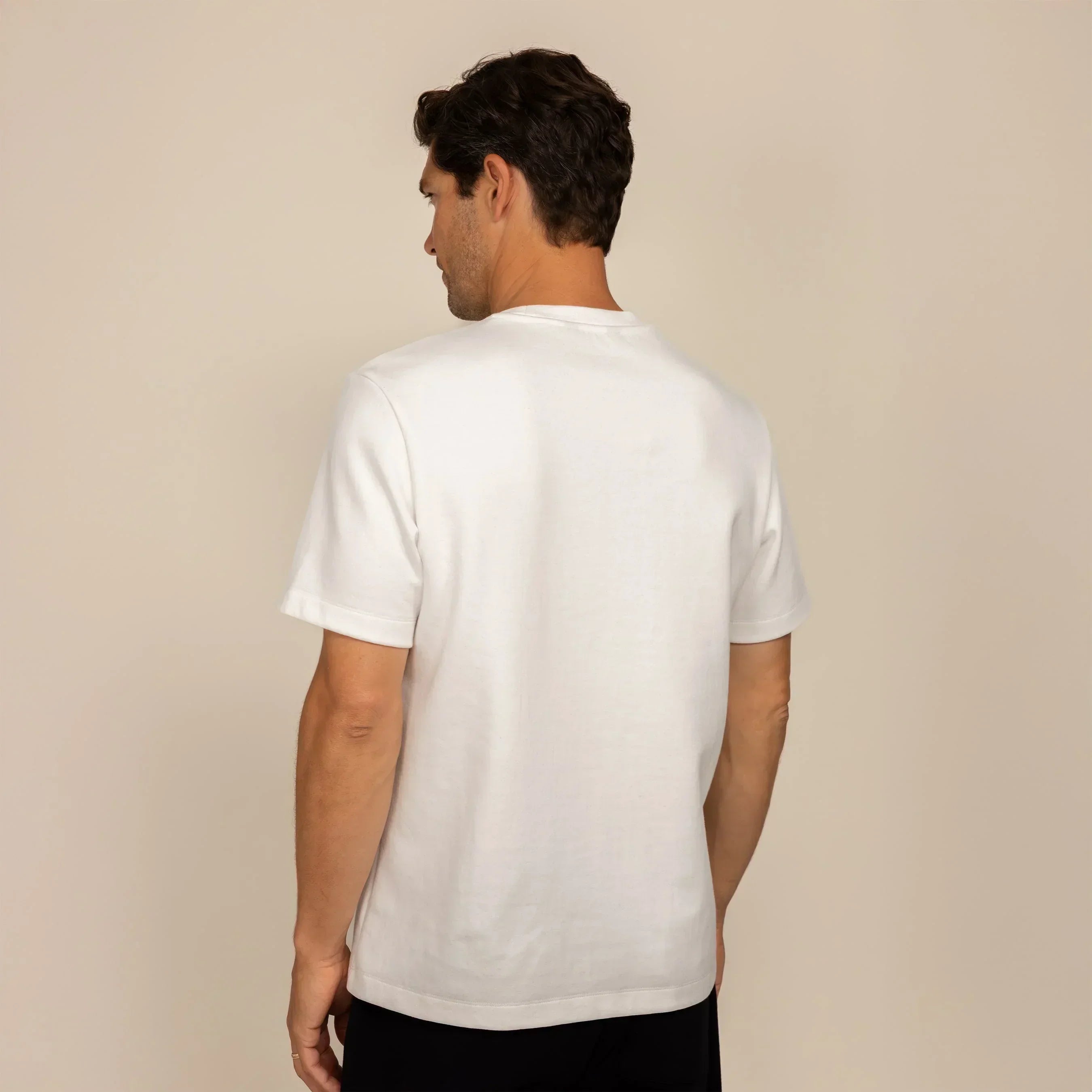 Man wearing a Marame Relaxed Fit T-Shirt in White, rear view. |White
