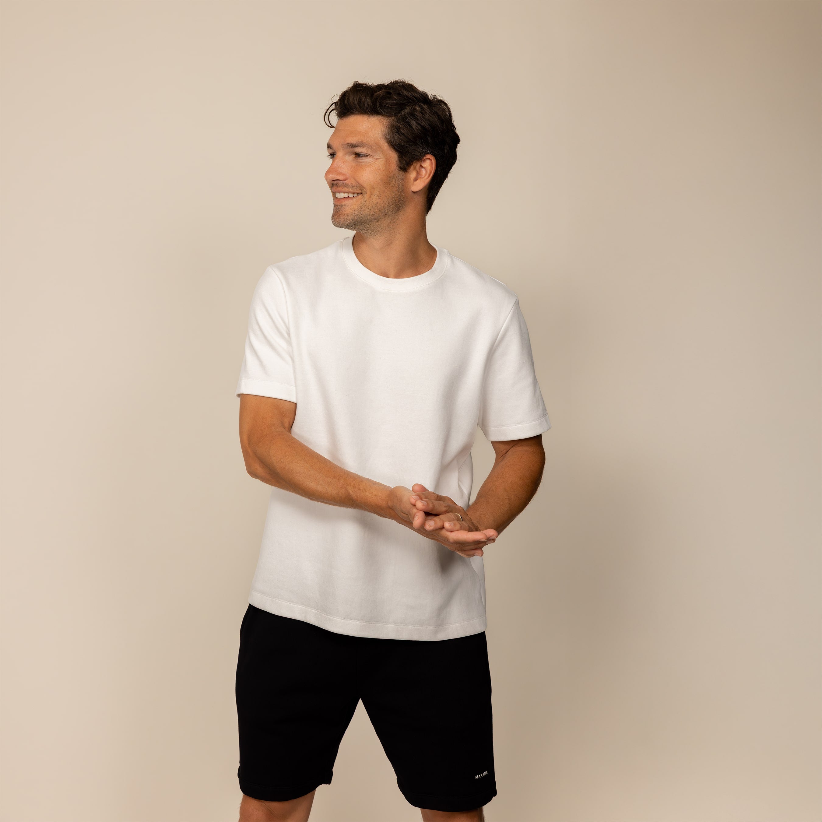 Man wearing a Marame Relaxed Fit T-Shirt in White, front view.