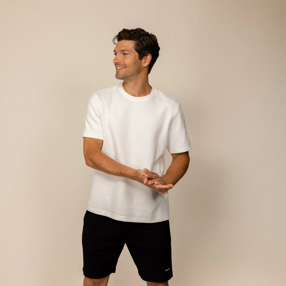 Man wearing a Marame Relaxed Fit T-Shirt in White, front view. |White