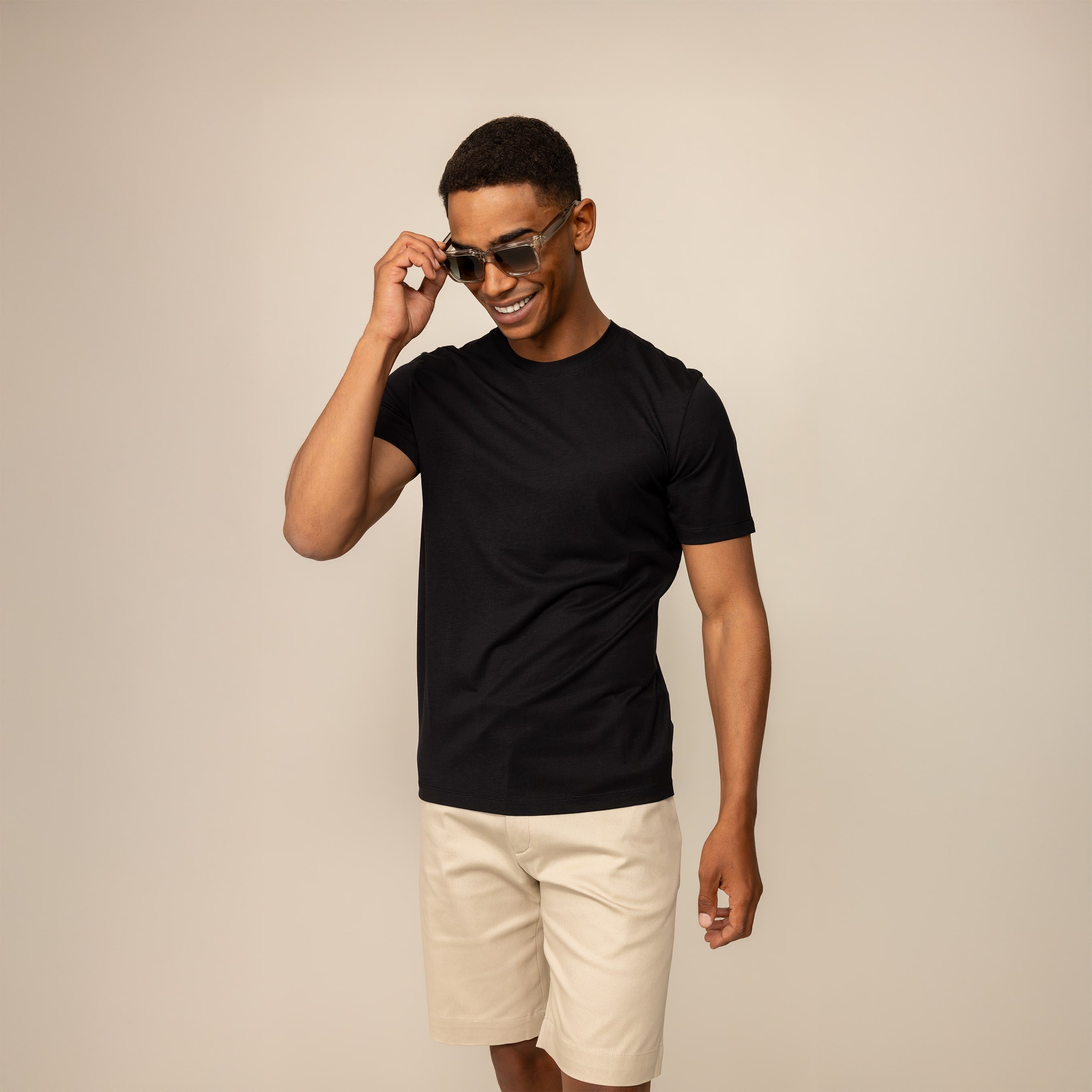 Man wearing a Marame Slim Fit Lyocell Blend T-Shirt in Black, front view.