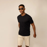Man wearing a Marame Slim Fit Lyocell Blend T-Shirt in Black, front view.