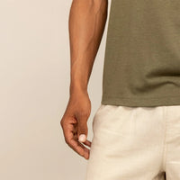 Man wearing a Marame Slim Fit Lyocell Blend T-Shirt in Olive, closeup.