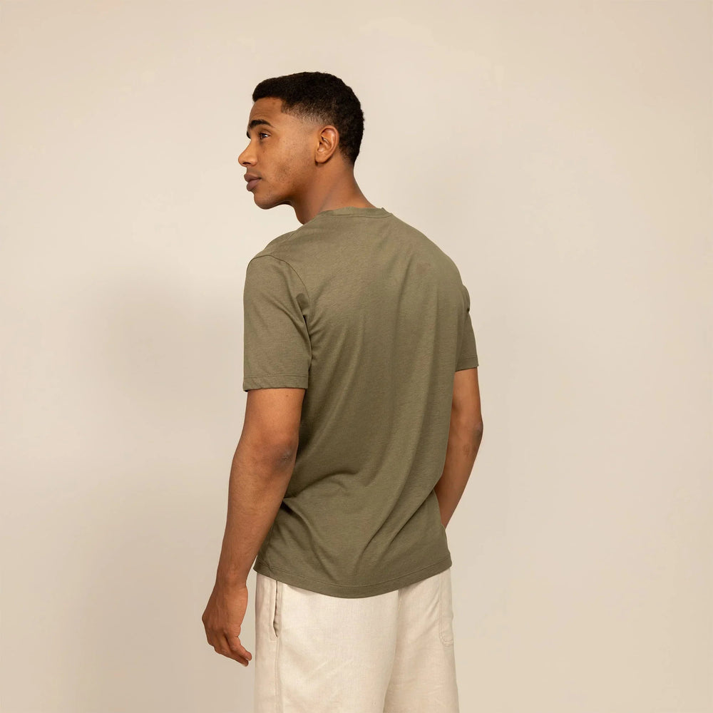 Man wearing a Marame Slim Fit Lyocell Blend T-Shirt in Olive, rear view. |Olive