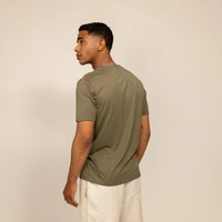 Man wearing a Marame Slim Fit Lyocell Blend T-Shirt in Olive, rear view.