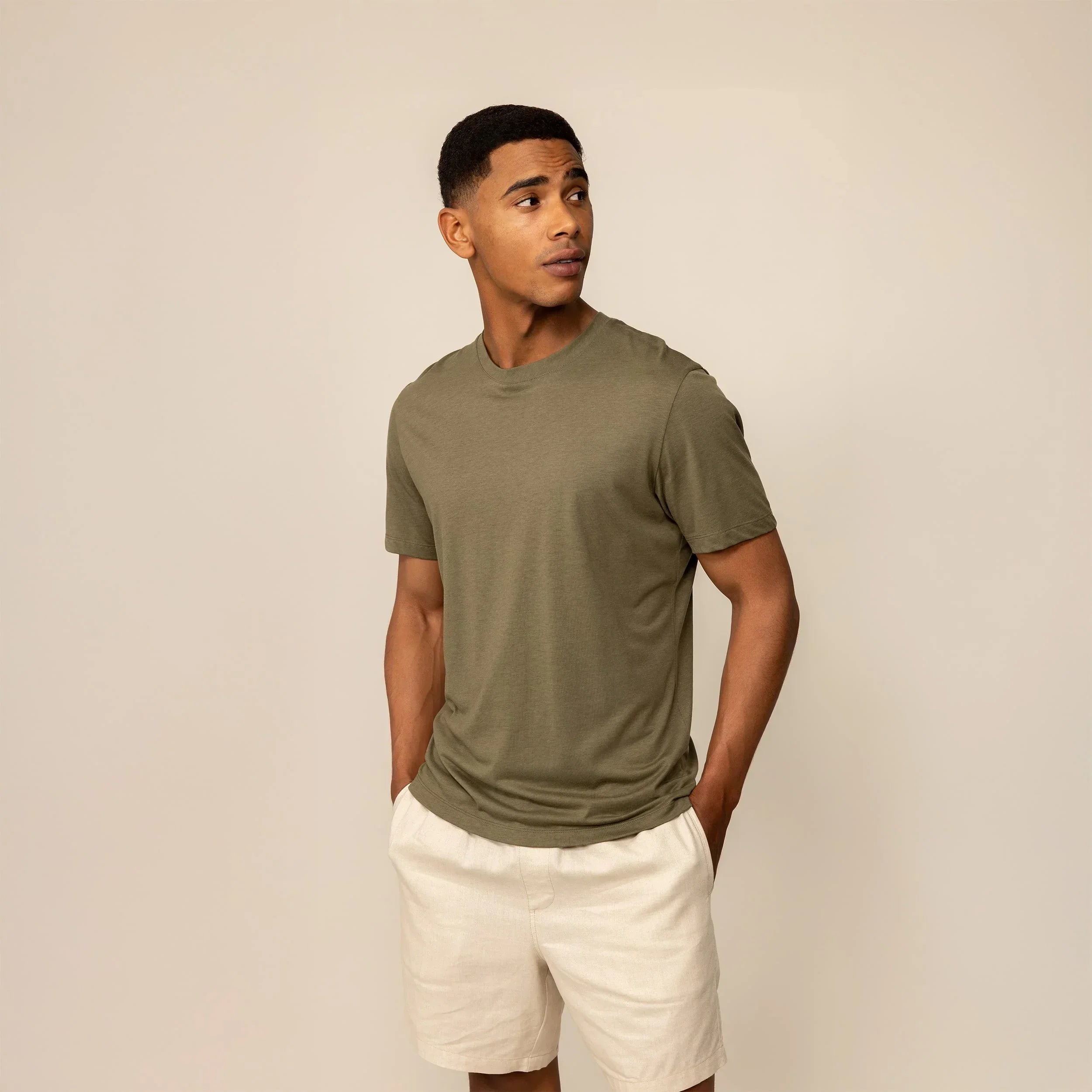 Man wearing a Marame Slim Fit Lyocell Blend T-Shirt in Olive, front view. |Olive