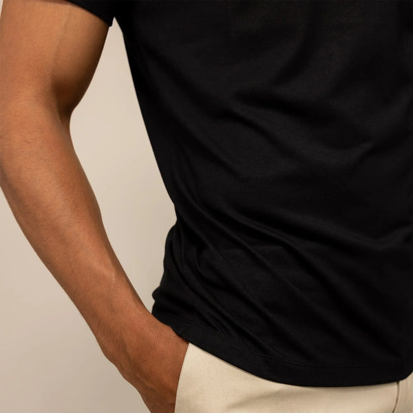 Man wearing a Marame Slim Fit Lyocell Blend T-Shirt in Black, closeup.