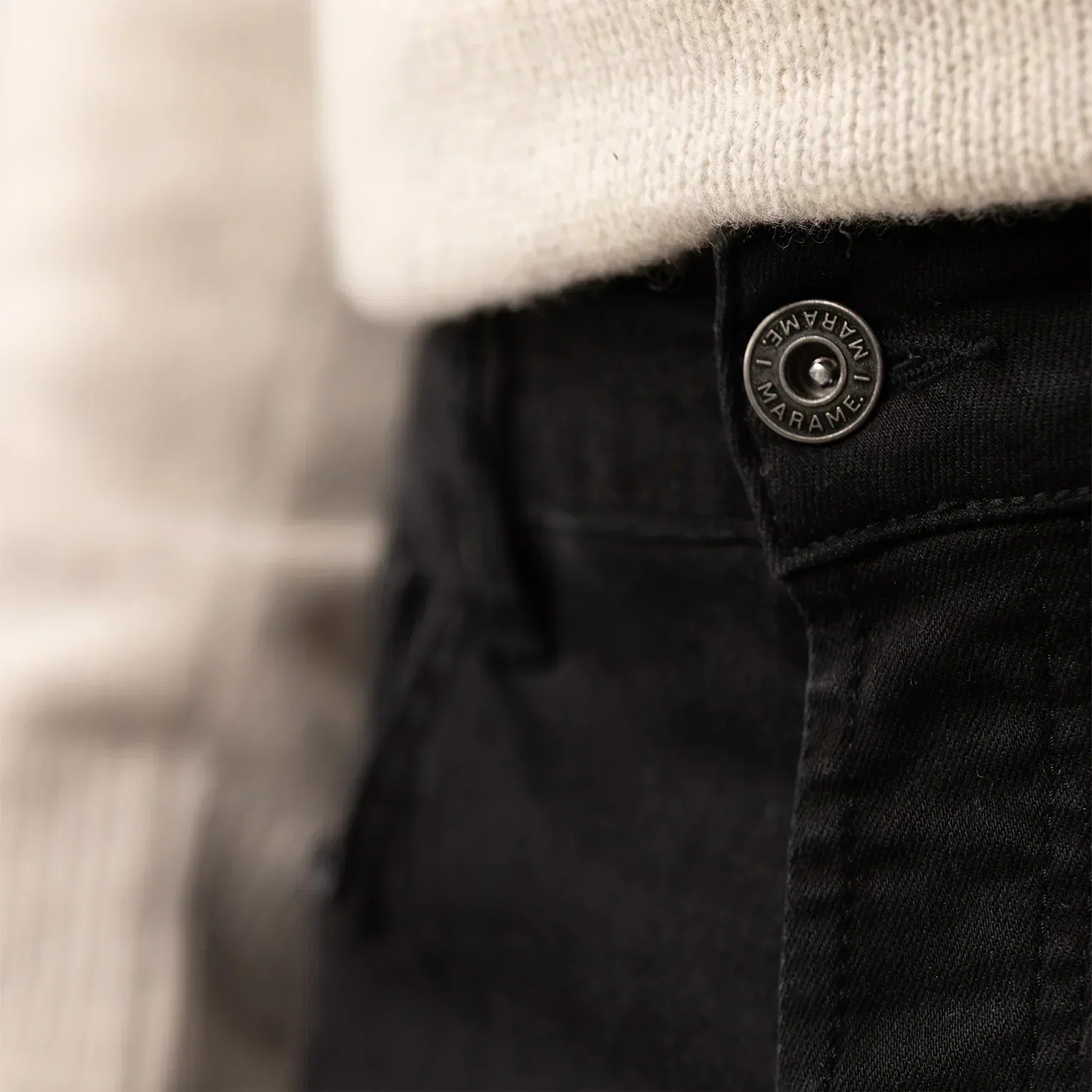 Man wearing Marame Slim Leg Denim Jeans in Black, closeup. |black denim