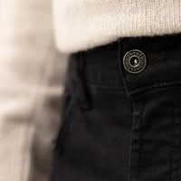 Man wearing Marame Slim Leg Denim Jeans in Black, closeup. |black denim