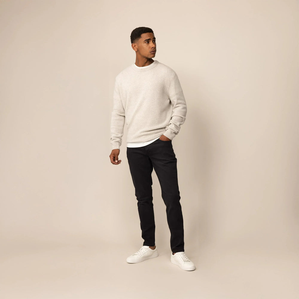 Man wearing Marame Slim Leg Denim Jeans in Black, front view. |black denim