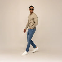 Man wearing Marame Slim Leg Denim Jeans in Classic Wash, front view.