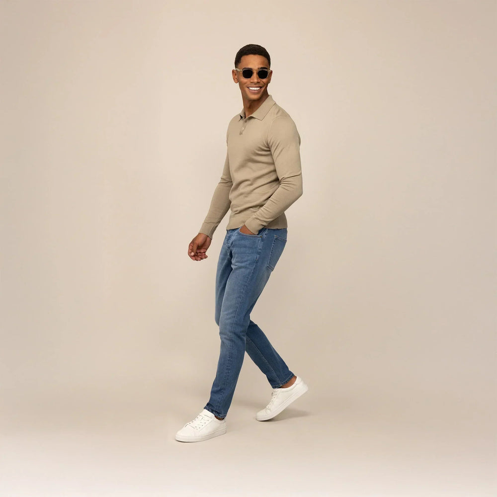 Man wearing Marame Slim Leg Denim Jeans in Classic Wash, front view. |classic wash denim