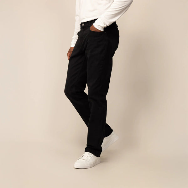 Man wearing Straight Leg Denim Jeans in Black, front view.