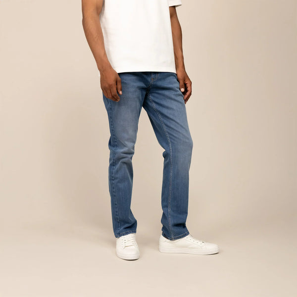 Man wearing Marame Straight Leg Denim Jeans in Classic Wash, front view.