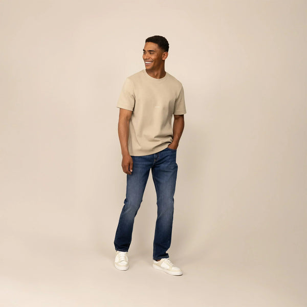 Man wearing Marame Straight Leg Denim Jeans in Navy Wash, front view. |navy wash denim