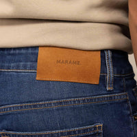 Man wearing Marame Straight Leg Denim Jeans in Navy Wash, rear view. |navy wash denim