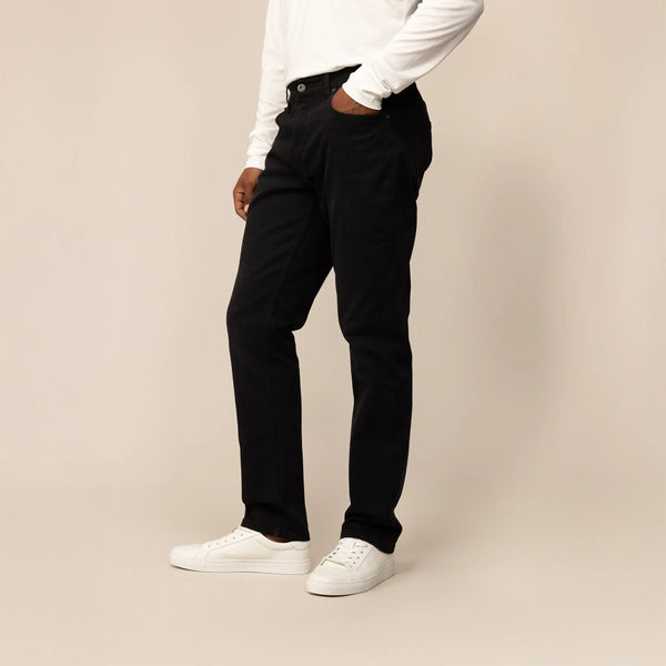 Man wearing Marame Straight Leg Denim Jeans in Black, front view.