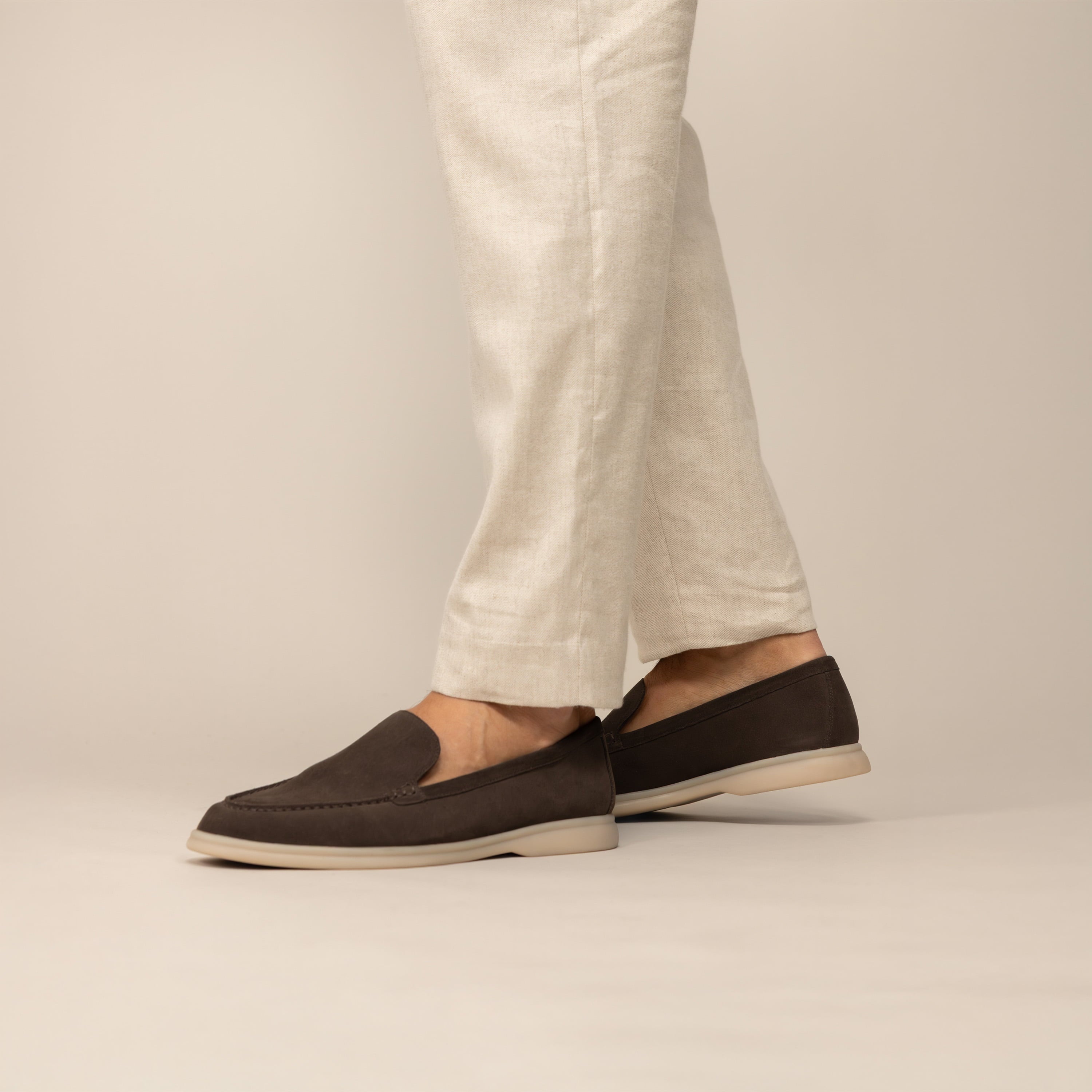 Man wearing Marame Suede Loafers in Burnt Brown, front view.
