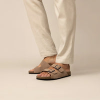 Man wearing Marame Suede Sandals in Clay, front view.