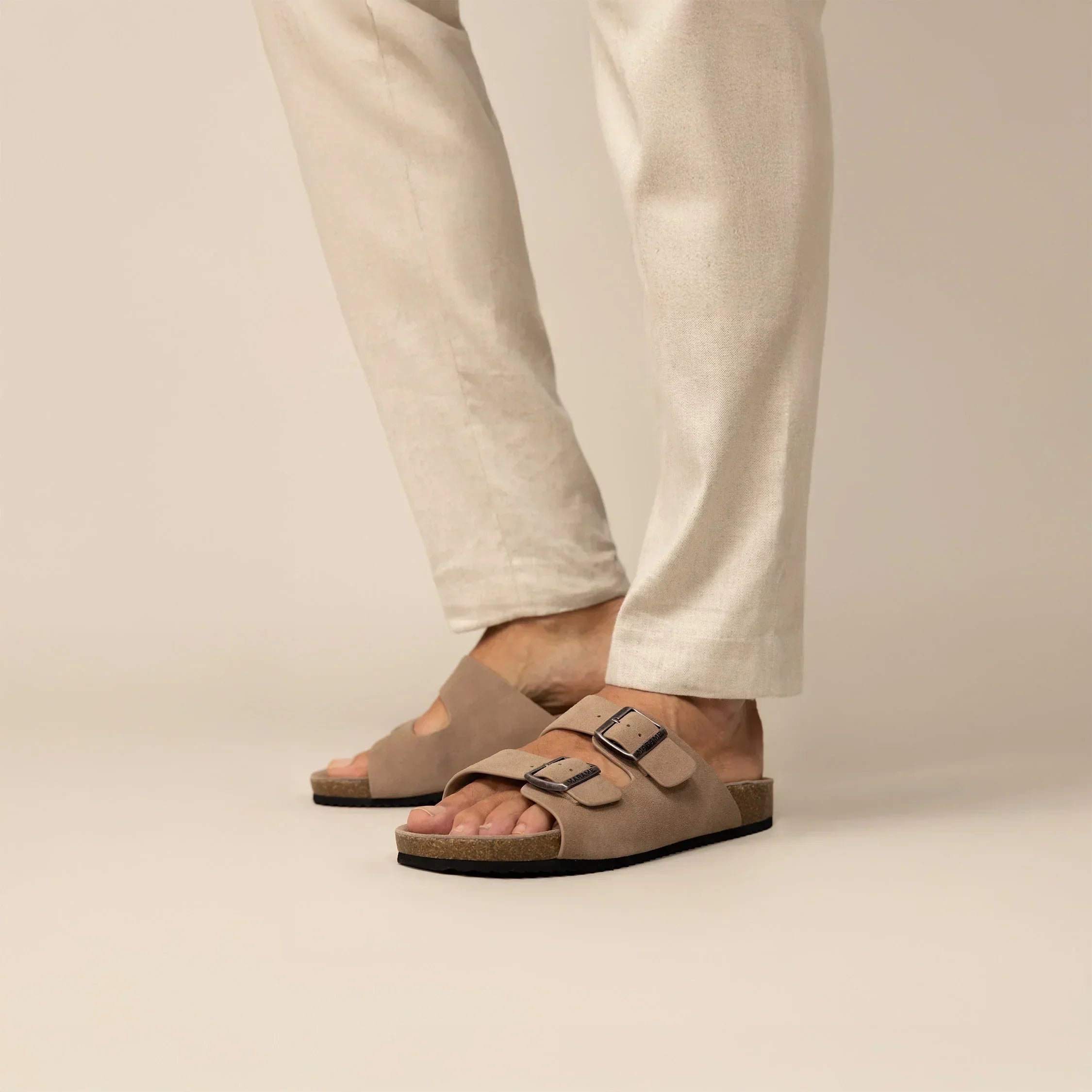 Man wearing Marame Suede Sandals in Clay, front view. |Clay