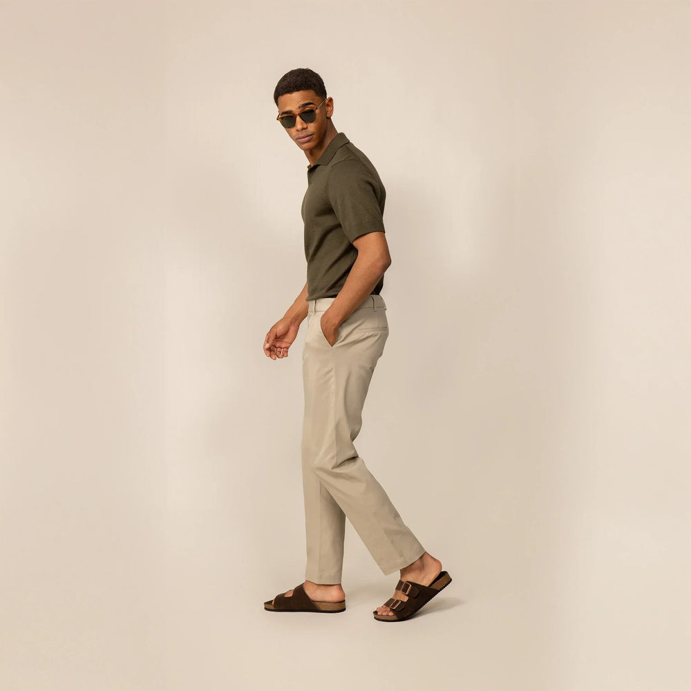 Man wearing Marame Classic Tapered Chinos in Almond Taupe, full view.