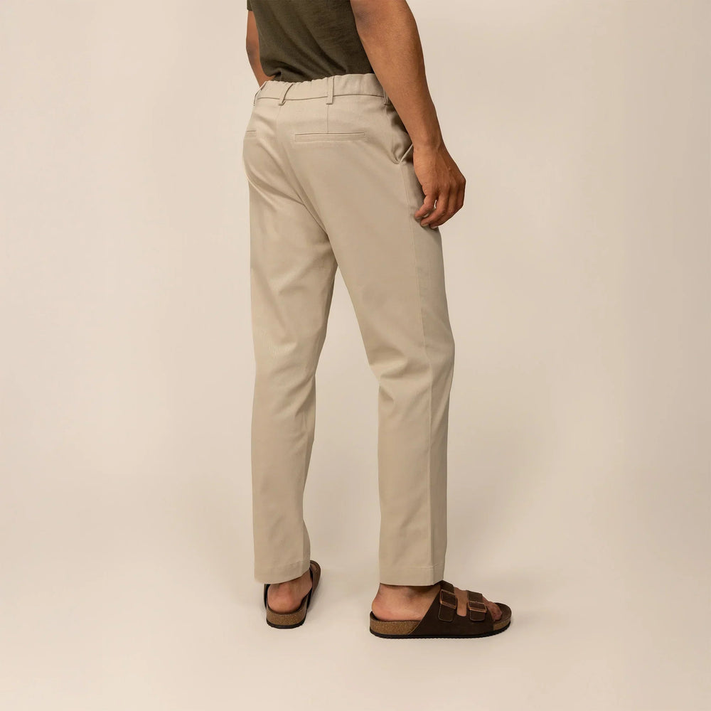 Man wearing Marame Classic Tapered Chinos in Almond Taupe, rear view | almond taupe