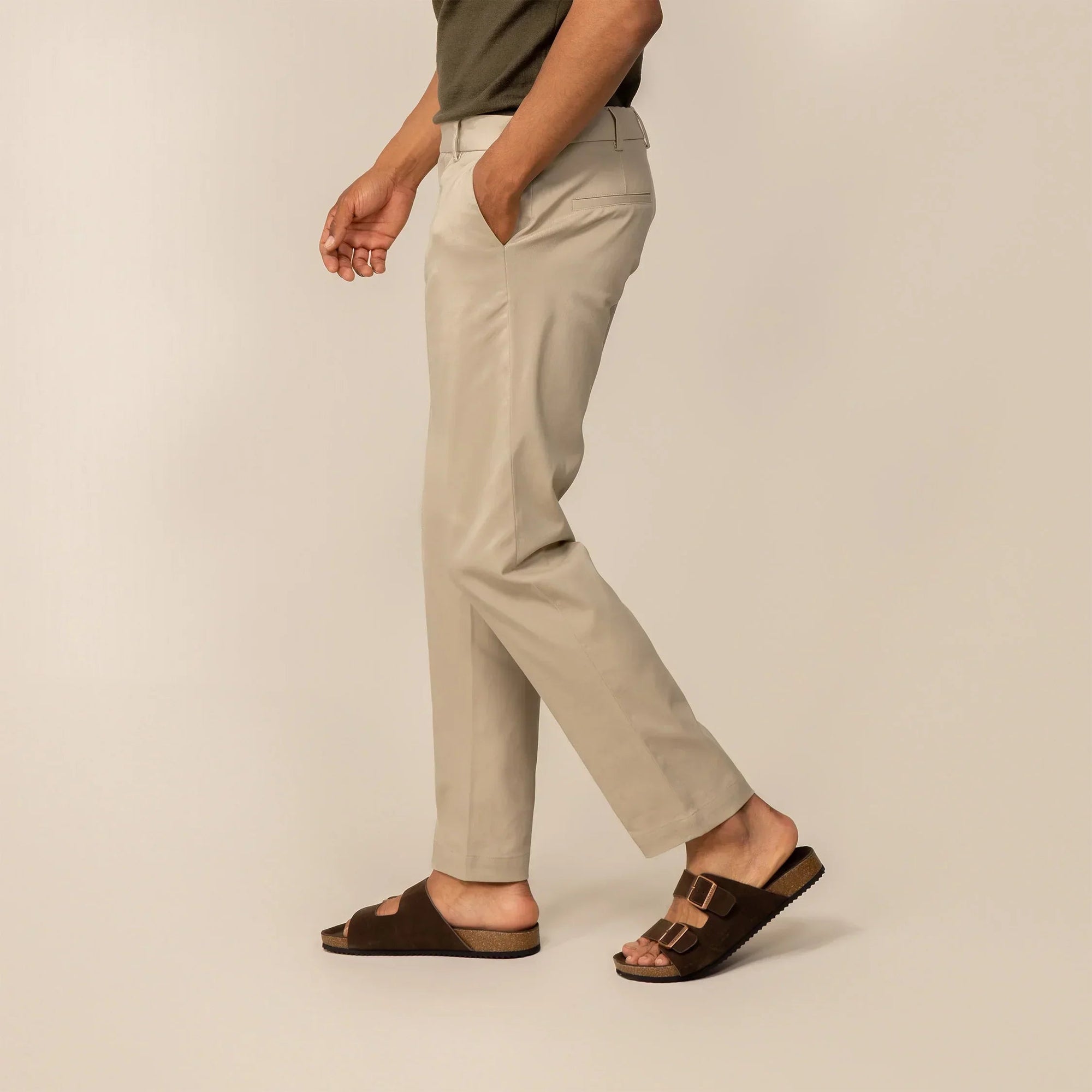 Man wearing Marame Classic Tapered Chinos in Almond Taupe, side view | almond taupe