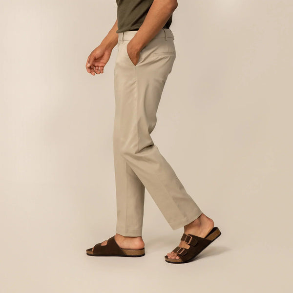 Man wearing Marame Classic Tapered Chinos in Almond Taupe, side view | almond taupe