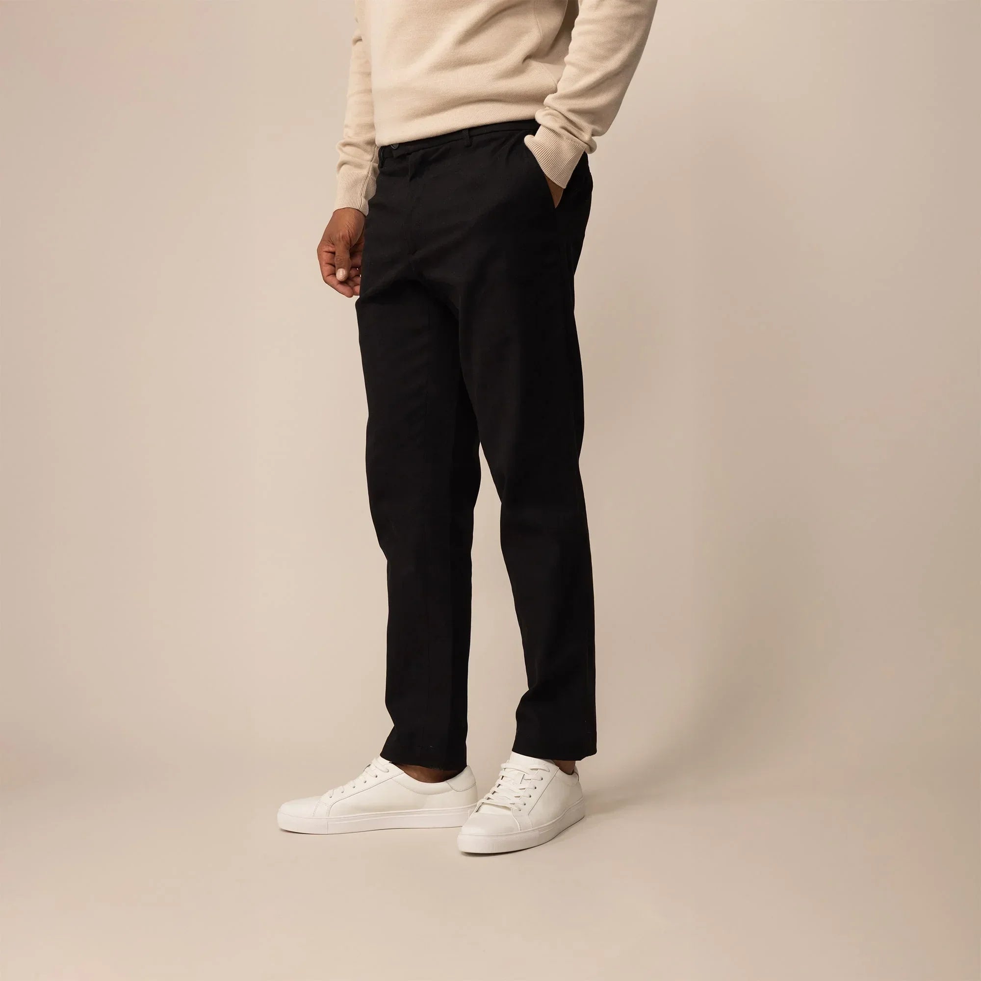 Man wearing Marame Tapered Chinos in Black, front view | black