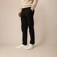 Man wearing Marame Tapered Chinos in Black, front view | black