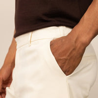 Man wearing Tapered Chinos in Ivory Stone, closeup.