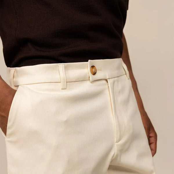 Man wearing Tapered Chinos in Ivory Stone, closeup.