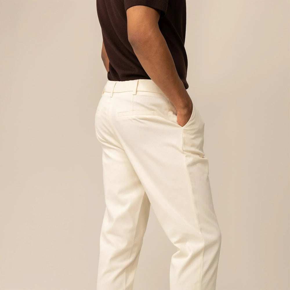 Man wearing Marame Tapered Chinos in Ivory Stone, rearview |ivory stone