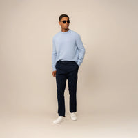 Man wearing Marame Tapered Chinos in Navy, front view.