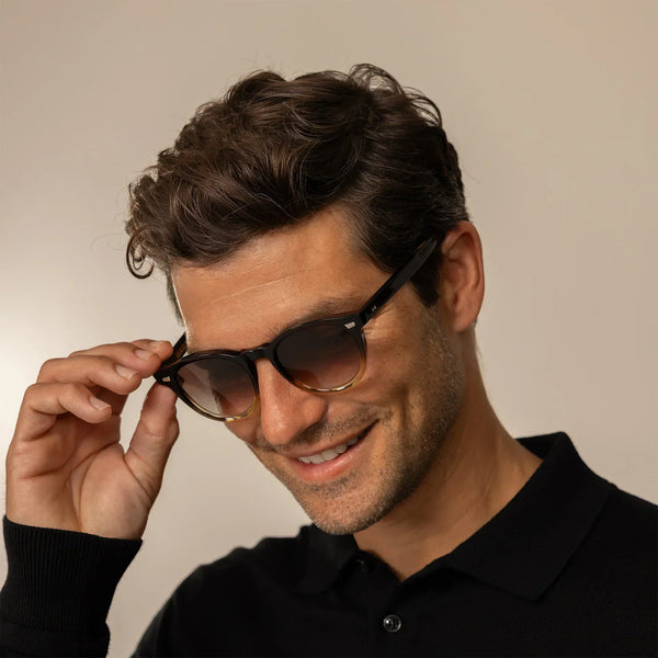 Man in Cutler and Gross Round Sunglasses 9378 in Honeyburst, front view.