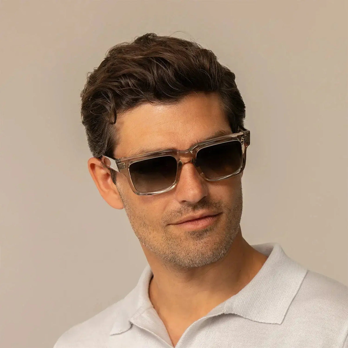
Man wearing Cutler and Gross Square Sunglasses 1403 in Sand Crystal, front view.