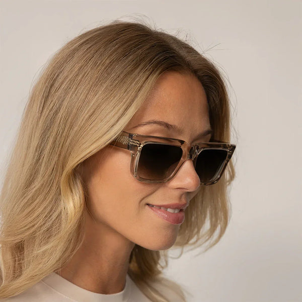 Woman wearing Cutler and Gross Square Sunglasses 1403 in Sand Crystal, front view.