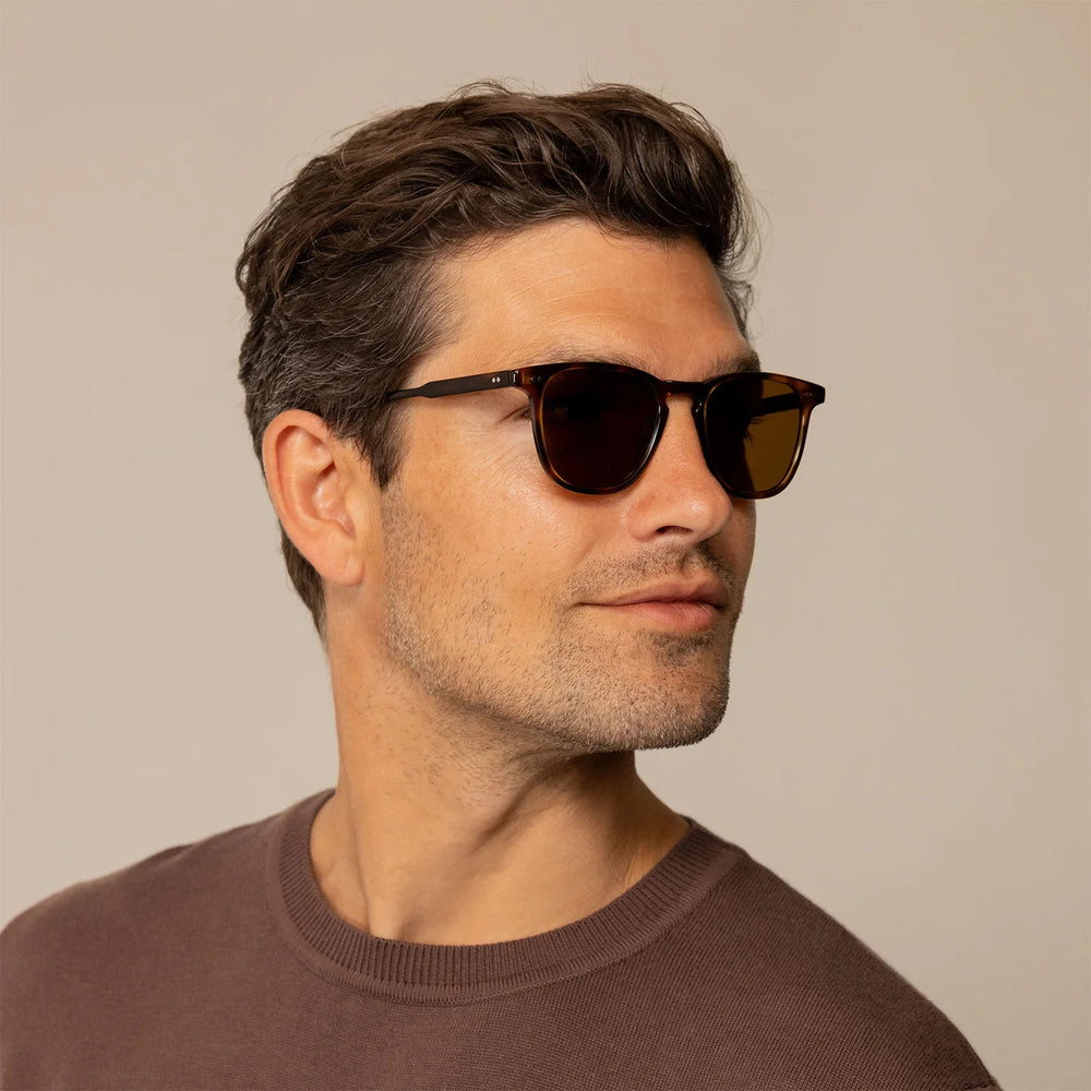 Man wearing Garrett Leight Brooks Sun Sunglasses in Spotted Brown Shell, front view.
