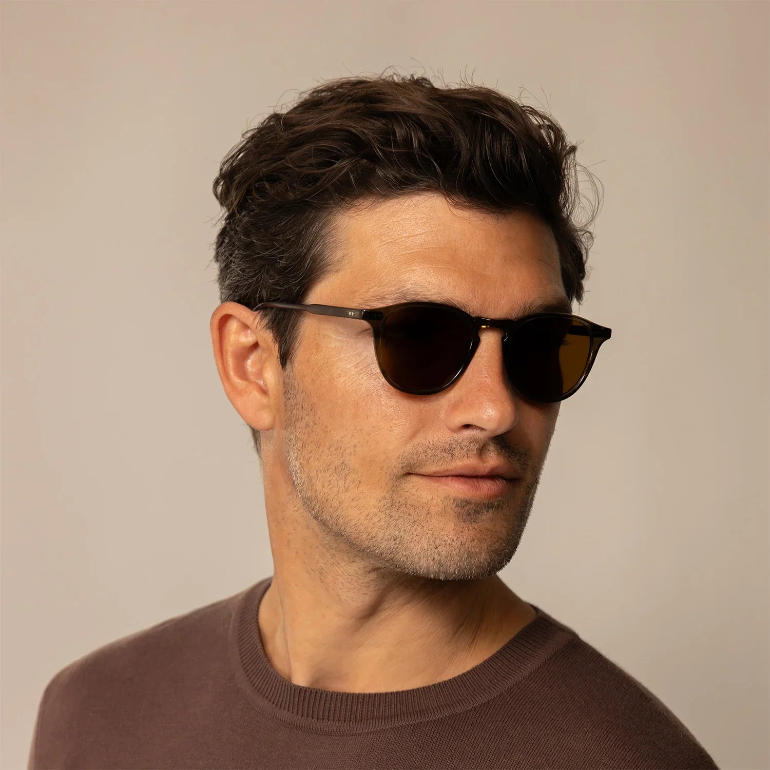 Man wearing Garrett Leight Clune Sun Sunglasses in True Demi, front view.|true demi