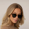Woman wearing Garrett Leight Clune Sun Sunglasses in True Demi, front view.|true demi