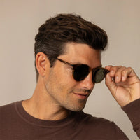 Man wearing Garrett Leight Hampton Sun Sunglasses in Olive Tortoise, front view.