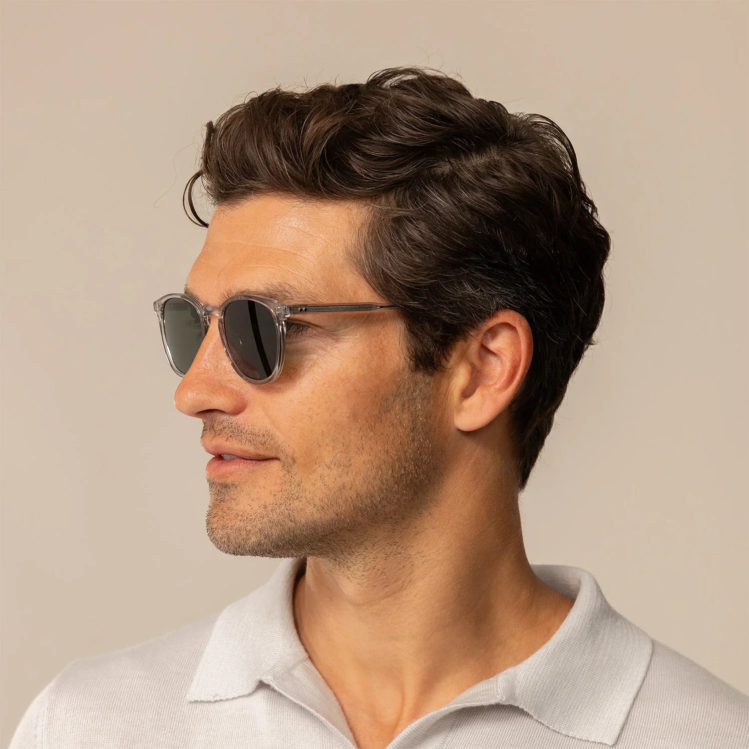 Man wearing Garrett Leight Kinney Sun Sunglasses in Light Light Grey, side view. | light light grey